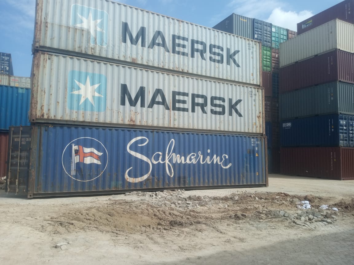 Shipping containers for sale in a yard